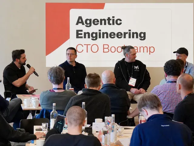 Denis Turkov moderating a panel at the Agentic Engineering CTO Bootcamp