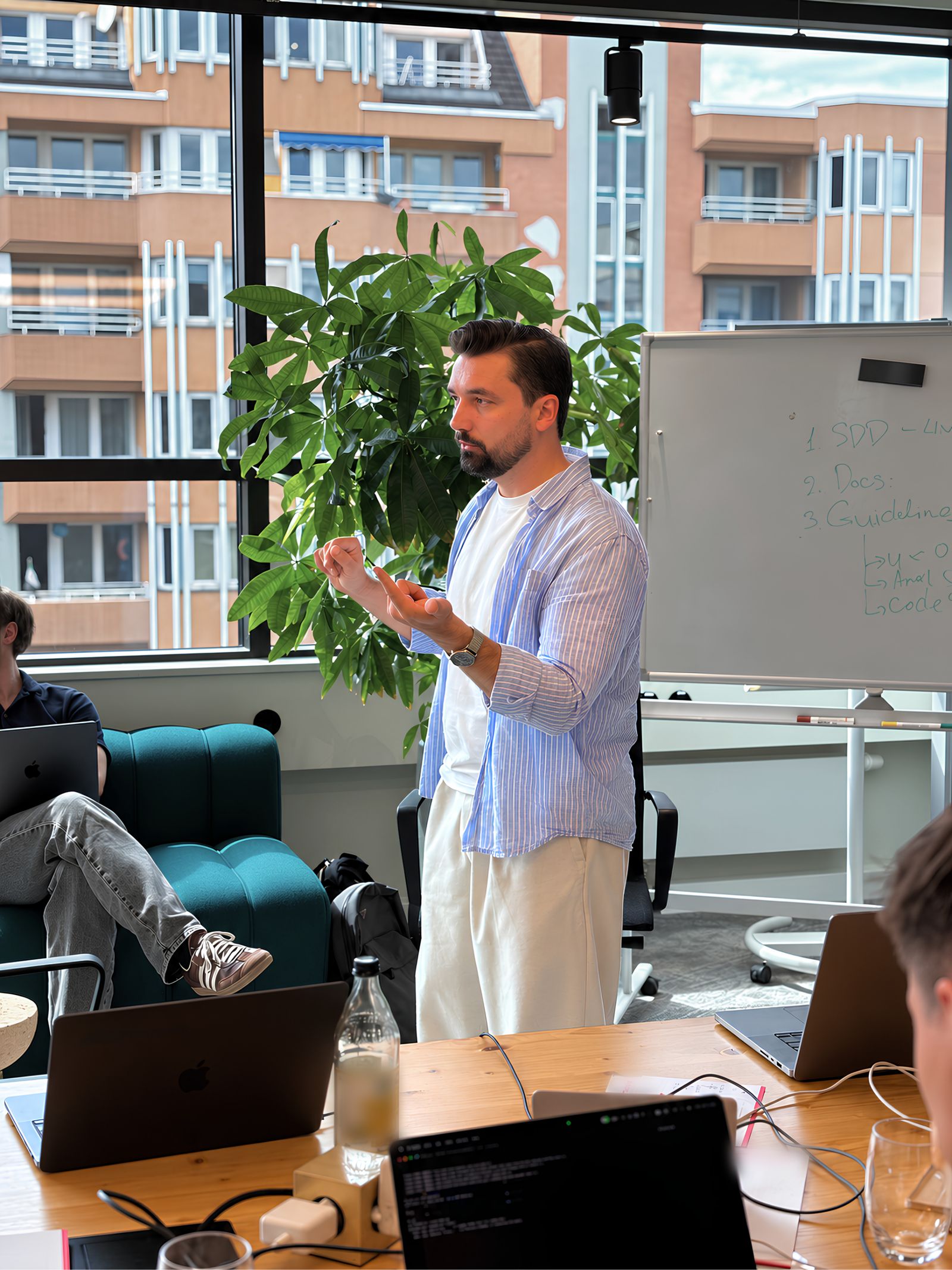 Denis Turkov walking an engineering team through the spec-driven workflow: SDD, docs, guidelines on the whiteboard
